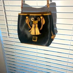 Authentic Dooney & Bourke, black with red interior. Clean and cute.